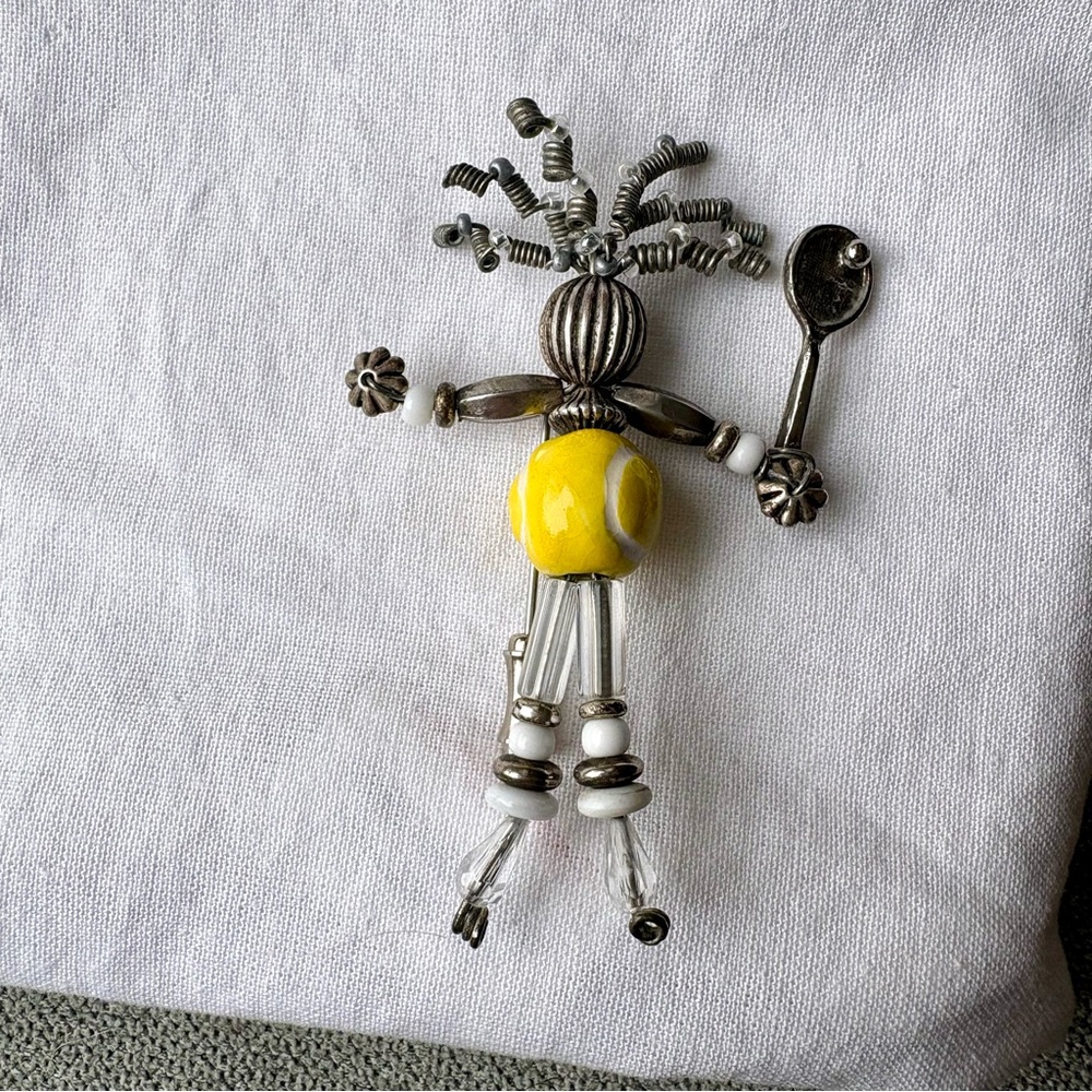 Silver and yellow tennis pin